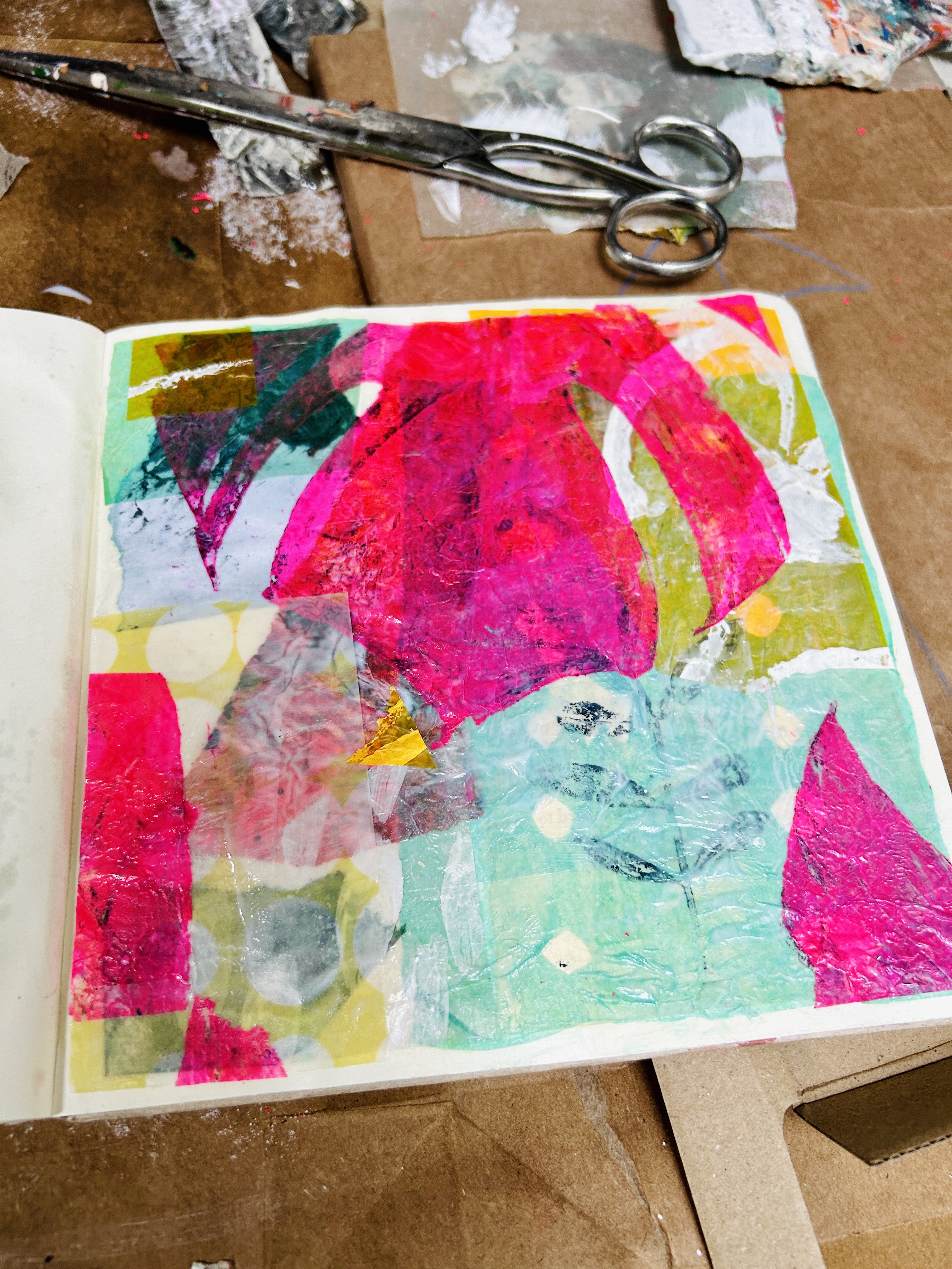 A collection of colored powders in different vibrant shades, neatly contained in small, weathered metal containers. The po...